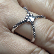 Criss Cross Ring with Paw Print in Sterling Silver on Model.