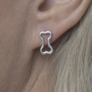 Dog Bone Post Earrings in Sterling Silver on Model.