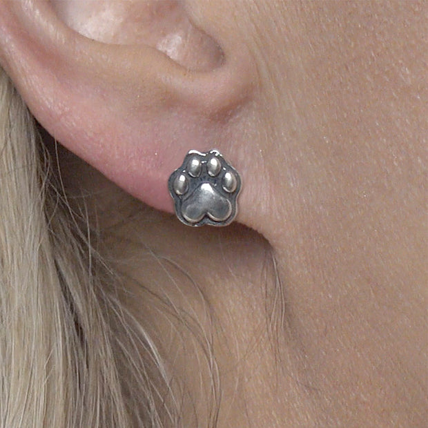 Paw Print Post Earrings in Sterling Silver on Model.