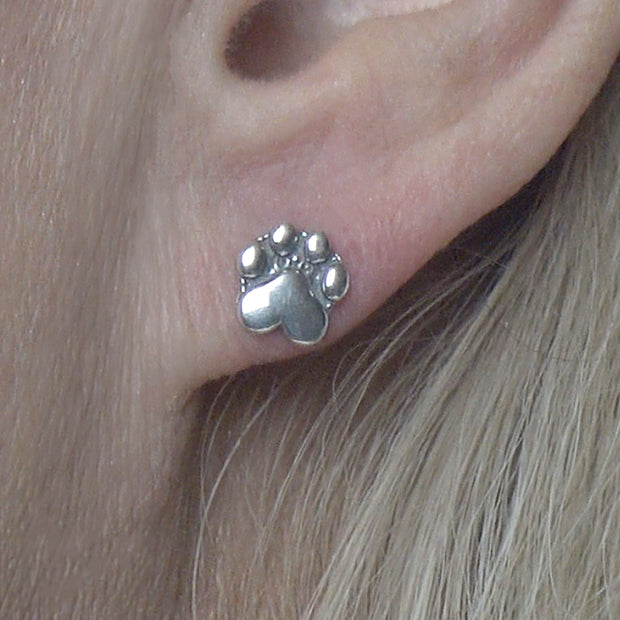 Paw Print Post Earrings in Sterling Silver on Model.