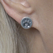 Paw Print with Heart Post Earrings in Sterling Silver on Model.