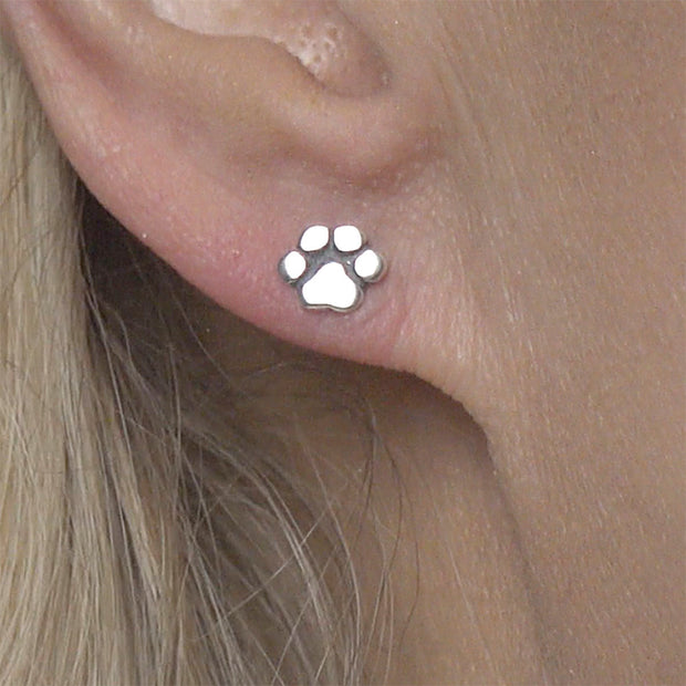 Paw Print Post Earrings in Sterling Silver on Model.