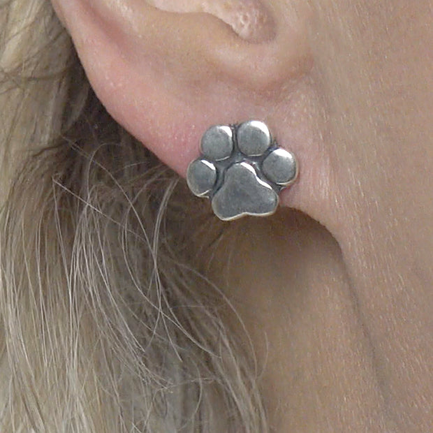 Paw Print Post Earrings in Sterling Silver on Model.