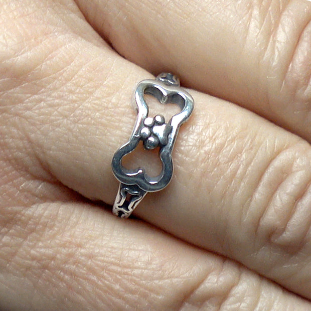 Dog Bone with Paw Print Ring in Sterling Silver on Model.