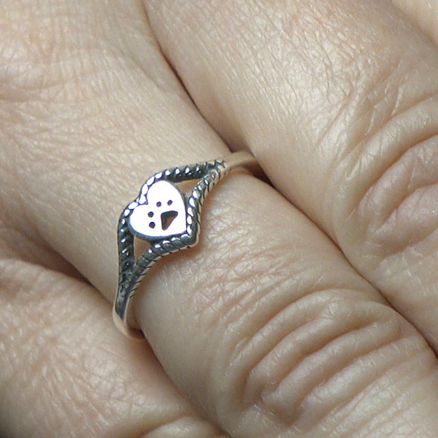 Heart with Cut Out Paw Print Ring in Sterling Silver on Model.