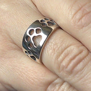 Paw Print Cut Out Band Ring in Sterling Silver on Model.