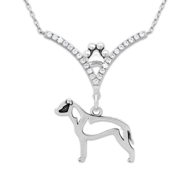 Rhodium plated sterling silver V shaped necklace accented with 23 triple A quality cubic zirconia. A petite paw print is nestled between the arches of the V with an American Staffordshire Terrier pendant suspended below